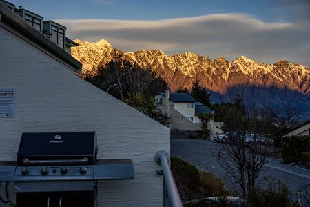 Scenic view of Queenstown, New Zealand during sunsetの写真素材