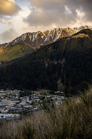 Scenic view of Queenstown, New Zealand during sunsetの写真素材
