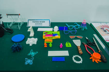 3D printer used to joined or solidified material under computer control to create a three-dimensional object, with material being added together layer by layer.のeditorial素材