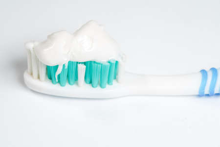 Toothbrush with toothpaste isolated on white backgroundの写真素材