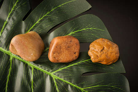 Zen concept: stones arranged against black backgroundの写真素材