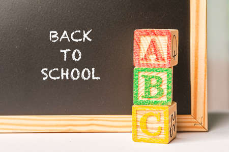 Back to School wordings on chalkboard with alphabet cubesの写真素材