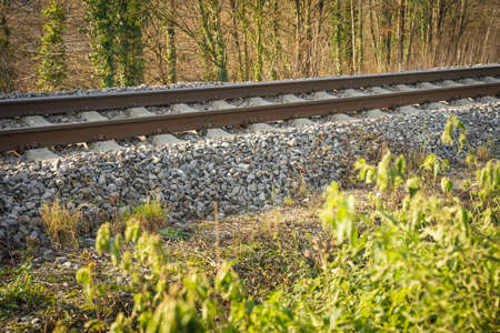 a train railway by the roadsideの写真素材