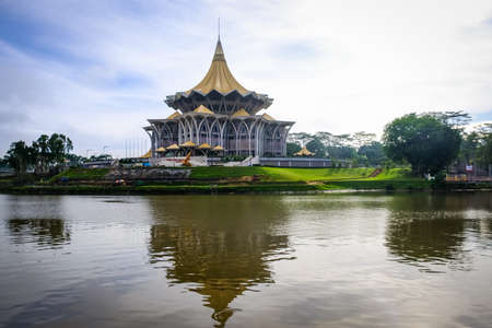 Scenic view of Kuching Waterfront showing darul hana bridge and sarawak goverment buildingのeditorial素材