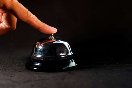 Reception Bell isolated against black backgroundの写真素材