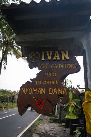 Balinese painter at work to produce paintings and artwork at a galleryのeditorial素材