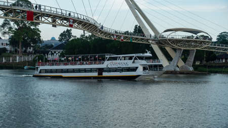 Sarawak River Cruise boat cruising along Sarawak River in Kuching Waterfrontのeditorial素材