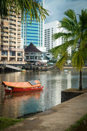 Fishing boats by the pier of Sarawak River at Kampung Boyan, Kuchingのeditorial素材