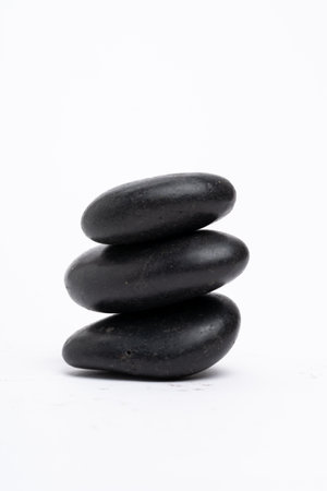 Zen concept: stones arranged against white backgroundの写真素材