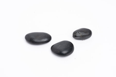 Zen concept: stones arranged against white backgroundの写真素材
