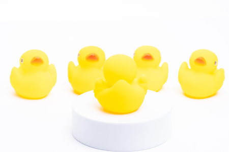 Leadership concept. A group of yellow rubber duck following the leaderの写真素材