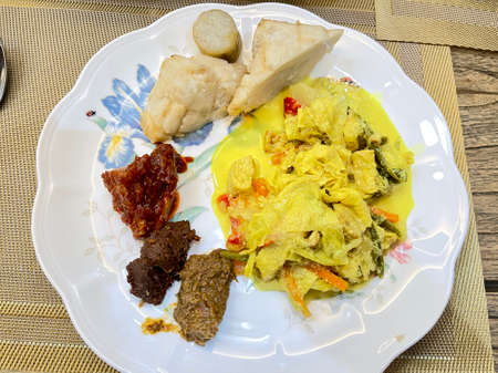 Malaysian local traditional food, lemang, ketupat, ketupat palas and other eat during eid mubarak or known as Hari Raya Aidilfitri celebration. Eat together with curry or rendang.の写真素材