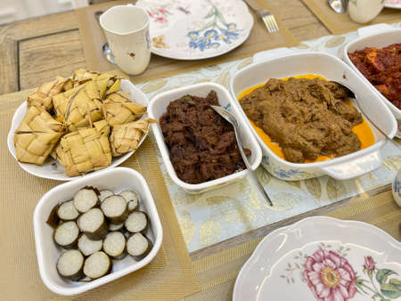 Malaysian local traditional food, lemang, ketupat, ketupat palas and other eat during eid mubarak or known as Hari Raya Aidilfitri celebration. Eat together with curry or rendang.の写真素材