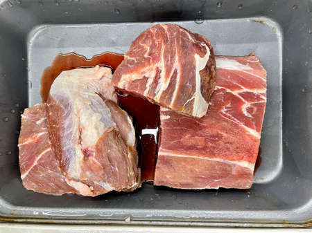 Fresh meat chunk at a butcher place at a supermarketの写真素材