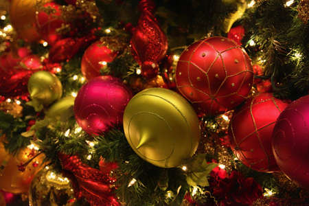 Multicolored and gold Christmas balls with lightingsの写真素材