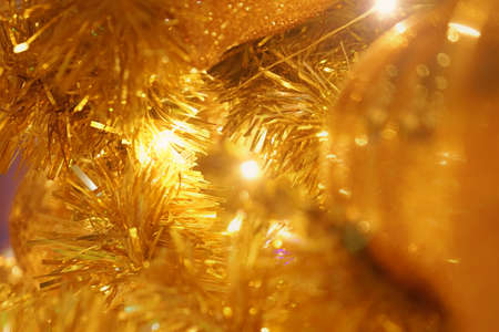 Multicolored and gold Christmas balls with lightingsの写真素材