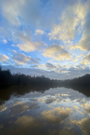 cloudy Sunset in the lake with reflectionの写真素材