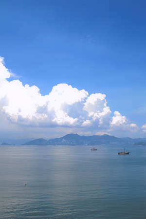 White sand beach and sea in the sunsetの写真素材
