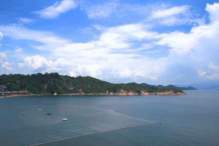 White sand beach and sea in the sunsetの写真素材