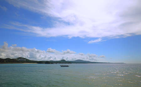 White sand beach and sea in the sunsetの写真素材