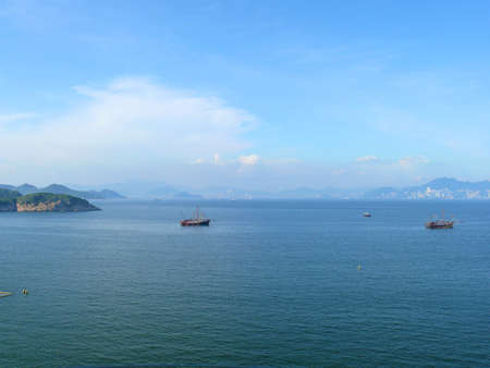 White sand beach and sea in the sunsetの写真素材