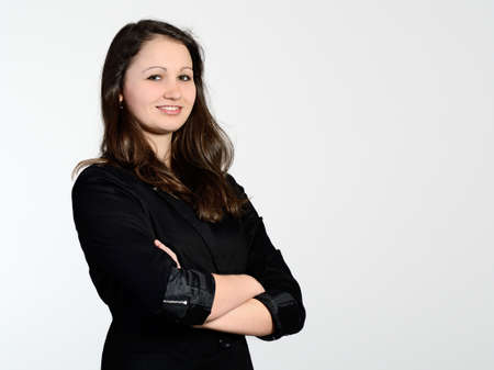 Young attractive business woman dressed in blackの写真素材