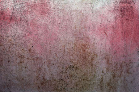 Old pink rusted and scratched doorの写真素材