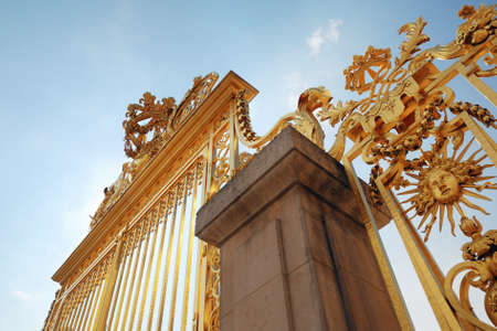 Golden decorated gateway to Versailles Chateauの写真素材