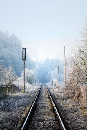 Local railway in Czech Republic in sunny and misty winter weatherの写真素材