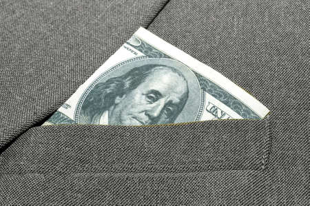banknote in a breast pocket of a jacket.