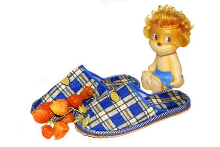 house slippers and childrens toy monkey の写真素材