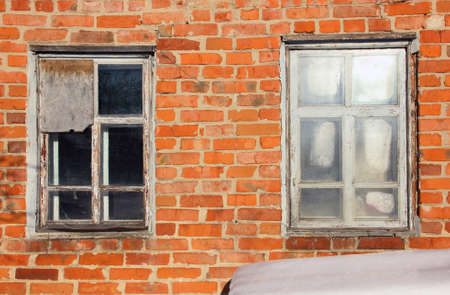 Old brick construction with two windows の写真素材