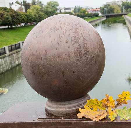 A decorative sphere and branch of oak leaves の写真素材