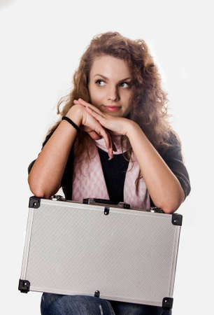 The young girl with a silvery case の写真素材