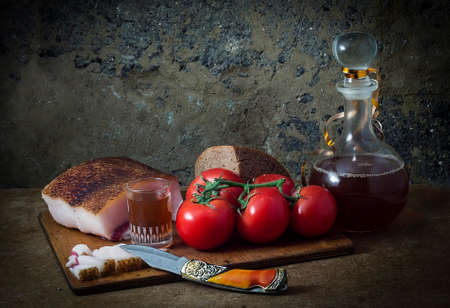 food still-life with tomatoes and fat.の写真素材