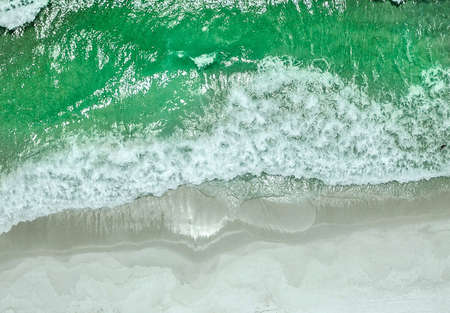 Wave of the sea on the sand beachの写真素材