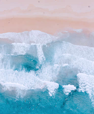 Wave of the sea on the sand beachの写真素材