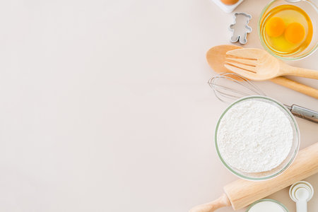 Baking ingredients for pastry on the pink pastel table