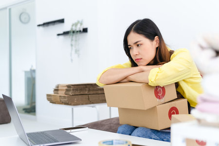 Young Asian business entrepreneur failure in online business, stressed woman with working problem....