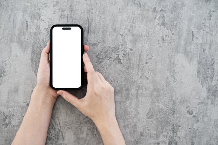 hand using phone white screen on top viewの写真素材