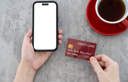 Online shopping in internet concept. Woman using credit card and blank smartphone on  Modern...