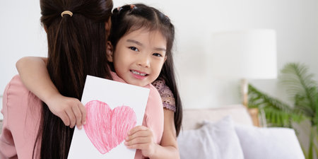 I love you. Smiling young woman getting presents from kids.  daughters giving mom handmade greeting...