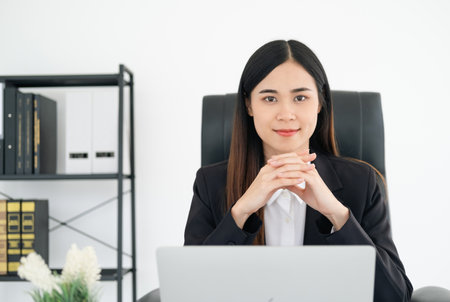 young female Lawyer or attorney working in the office, smiling and looking at camera.の写真素材