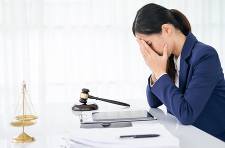 A lawyer or businessman is stressed about losing a lawsuit and going bankrupt.の写真素材