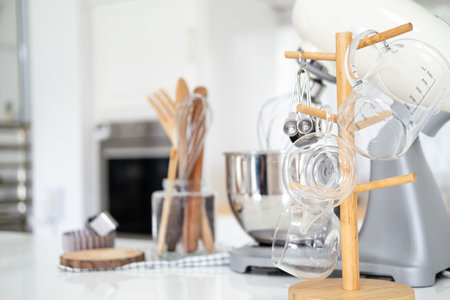 Kitchen utensils and wooden tools for homemade baking on a light kitchen background. Selective...