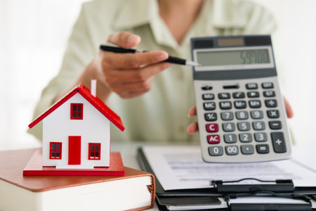 real estate agents talk about renting or buying a home in the office.の写真素材