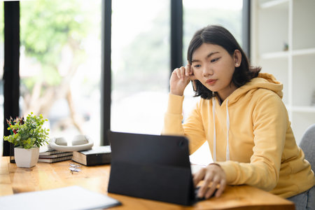 Asian girl student online learning class study online video call zoom teacher, Happy asian girl learn english language online with computer laptop.の写真素材