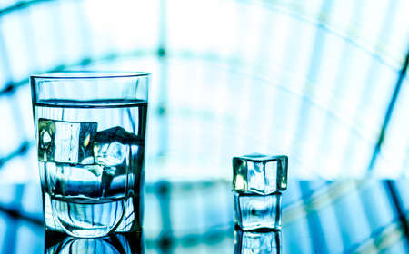 glass of water with ice cube