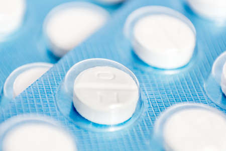 Pills in blue blister closeup