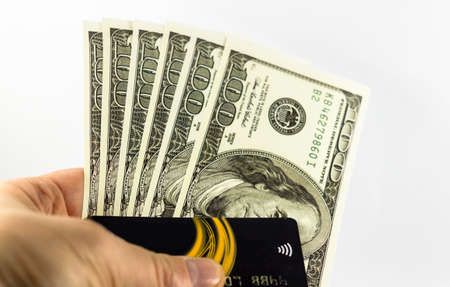 Hand Hold Credit cards and dollars in cashの写真素材